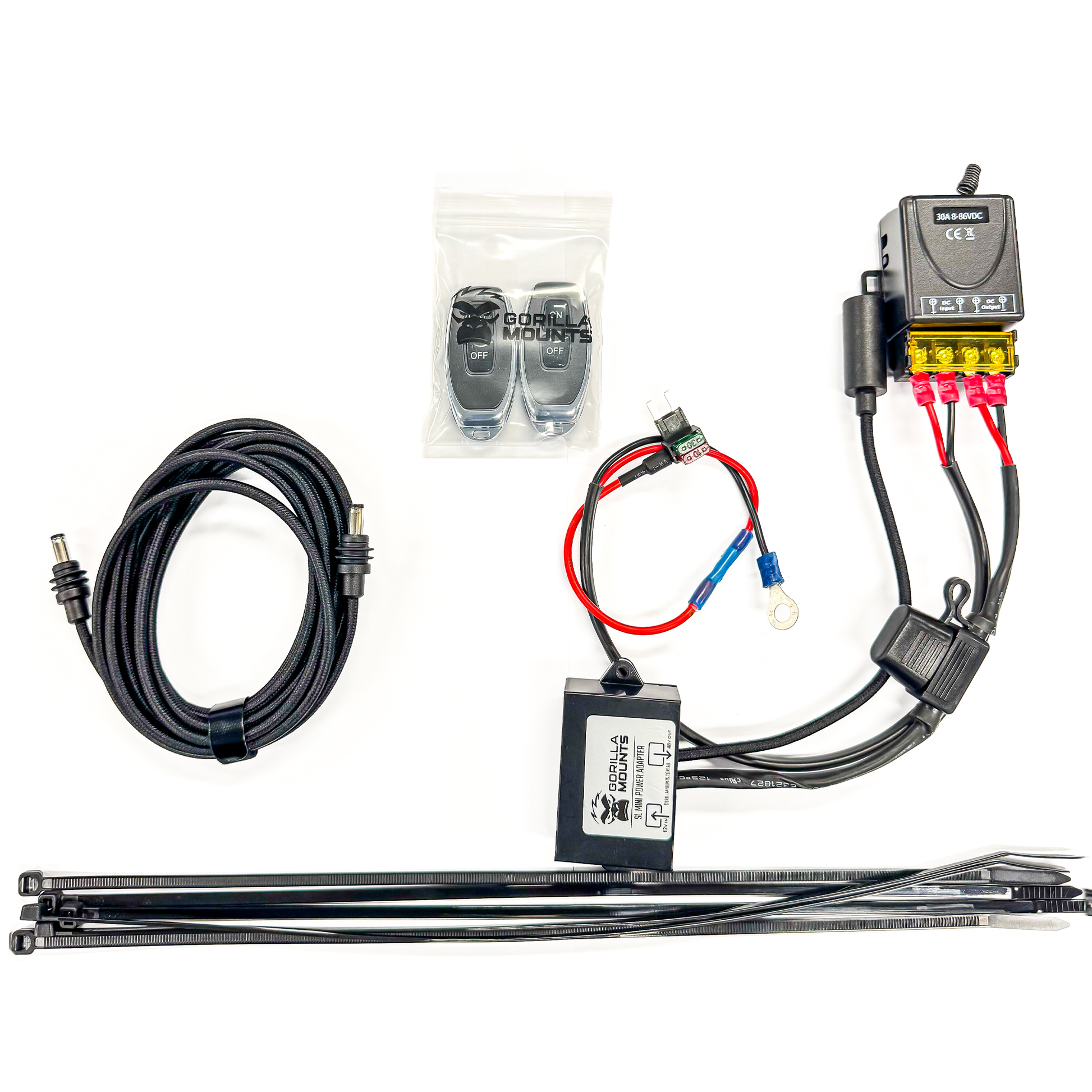 LC300 power components laid out with 3 m cable, remote controls, adapter and cable ties