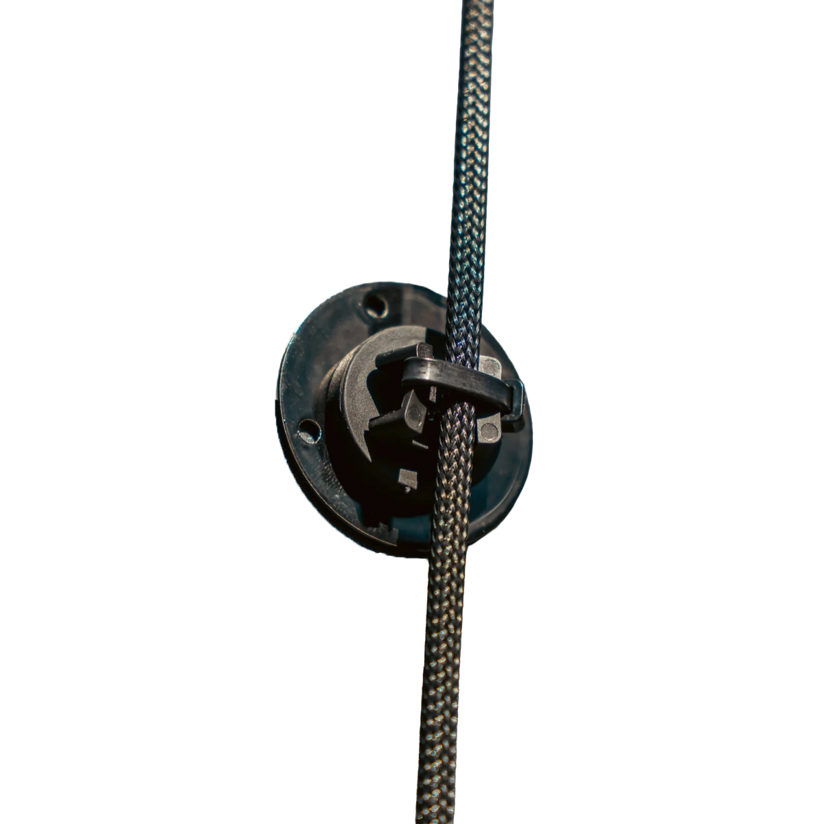 Black 22 mm cable mounting magnet securing a braided cable to a metal panel