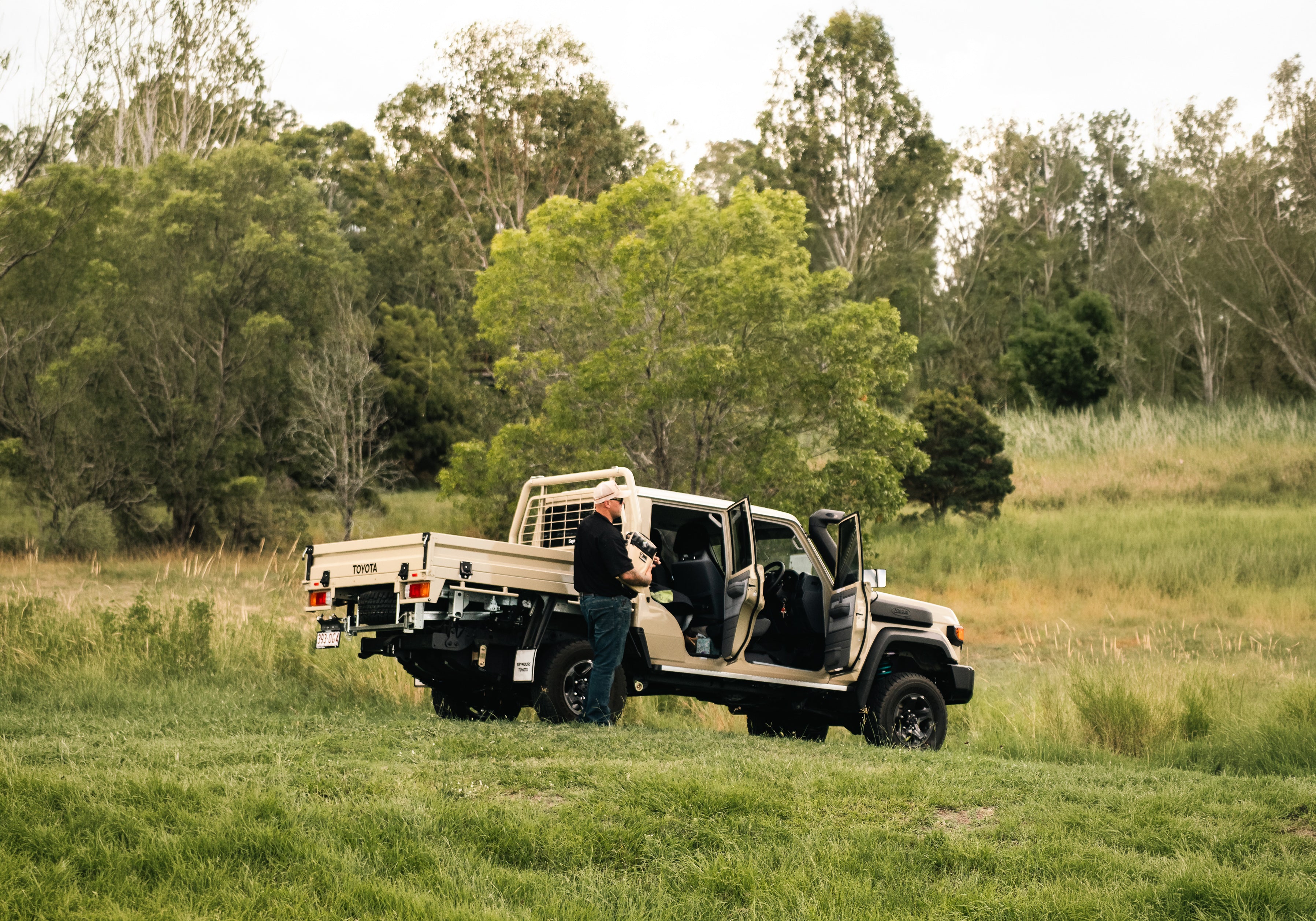 Toyota touring ute parked in a grassy Queensland paddock