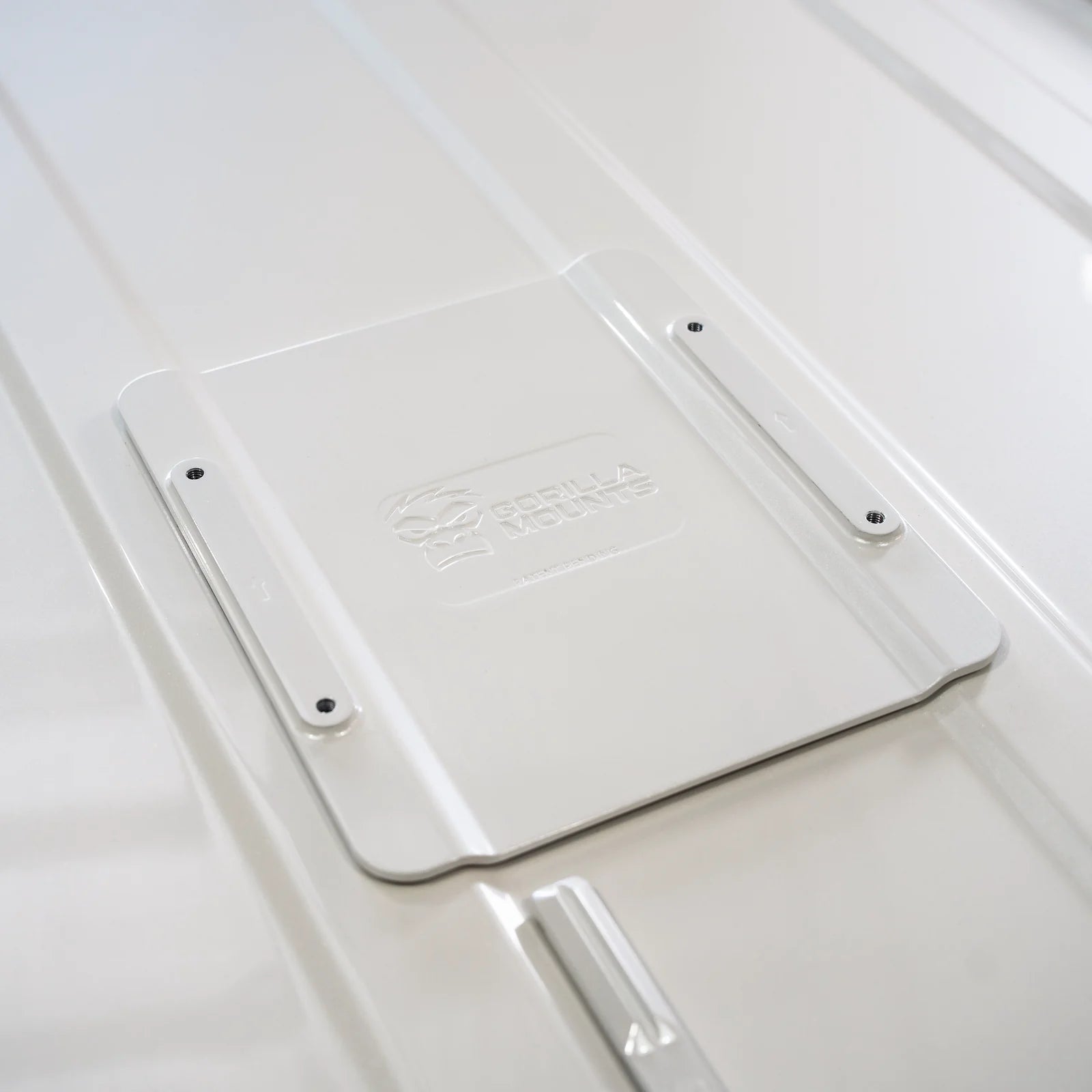 White LC300 billet roof plate bonded between the LandCruiser roof ribs